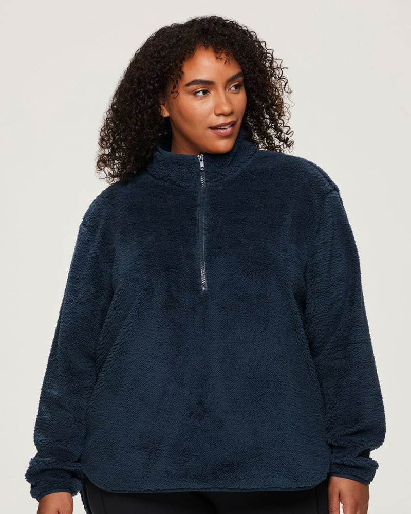 Front of a model wearing a size 1X Dylan 1/4-Zip Sherpa Pullover in Dark Teal by RBX Active. | dia_product_style_image_id:348485